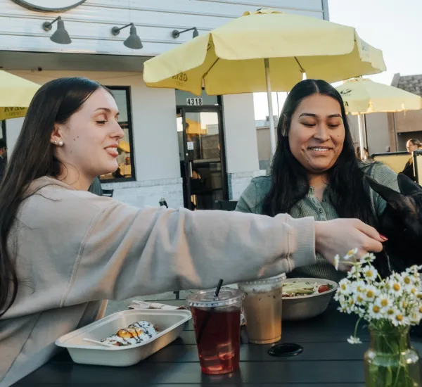 two women enjoy brunch at the twisted egg shack